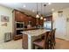 Gourmet kitchen boasts granite countertops, stainless steel appliances, and a convenient center island with seating at 20581 N Enchantment Pass, Maricopa, AZ 85138