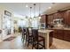 Open-concept kitchen featuring a center island, modern appliances, and seamless flow into the dining area at 20581 N Enchantment Pass, Maricopa, AZ 85138