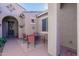 Charming patio with a table and chairs, providing an intimate outdoor space for gatherings at 20581 N Enchantment Pass, Maricopa, AZ 85138