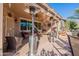 Covered patio with outdoor seating and heaters, perfect for entertaining at 20581 N Enchantment Pass, Maricopa, AZ 85138