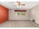 Inviting bedroom offers carpet, windows, and a ceiling fan, creating a relaxing and comfortable atmosphere at 2114 E Hale St, Mesa, AZ 85213