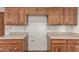 Kitchen features wooden cabinetry and countertops with a dedicated space for appliances and storage solutions at 2114 E Hale St, Mesa, AZ 85213