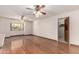 Spacious living room features hardwood floors, ceiling fans, and ample natural light from the window at 2114 E Hale St, Mesa, AZ 85213