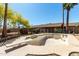 An empty in-ground pool with diving board is ready for renovation at 2114 E Hale St, Mesa, AZ 85213