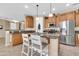 Eat-in kitchen featuring stainless steel appliances, granite countertops, and custom cabinetry at 2189 W Mila Way, San Tan Valley, AZ 85144