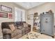 Comfortable living room with a brown reclining sofa and charming decor at 2189 W Mila Way, San Tan Valley, AZ 85144