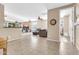View of living room with tile floors, ceiling fans, plantation shutters, and an open concept design at 2189 W Mila Way, San Tan Valley, AZ 85144