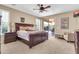 Cozy main bedroom with sliding door access to the backyard and neutral carpeting at 2189 W Mila Way, San Tan Valley, AZ 85144