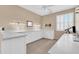 Well-lit office space featuring built-in white cabinetry and plenty of workspace at 2189 W Mila Way, San Tan Valley, AZ 85144