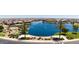 Aerial view of the community lake and the homes that surround it at 22045 N Rummler Ln, Maricopa, AZ 85138