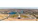 Beautiful aerial view of community baseball field and lakefront homes in a well-planned neighborhood at 22045 N Rummler Ln, Maricopa, AZ 85138