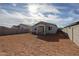 Large backyard is enclosed by block wall, offering privacy and space at 22045 N Rummler Ln, Maricopa, AZ 85138