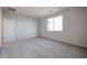 Comfortable carpeted bedroom with a window, offering a serene retreat at 22045 N Rummler Ln, Maricopa, AZ 85138