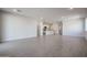 Expansive living area with tile flooring, recessed lighting, and an open layout at 22045 N Rummler Ln, Maricopa, AZ 85138