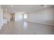 Open concept living area featuring tile flooring, recessed lighting, and lots of natural light at 22045 N Rummler Ln, Maricopa, AZ 85138