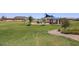Community park featuring a grassy area, playground, and picnic shelter, perfect for outdoor activities at 22045 N Rummler Ln, Maricopa, AZ 85138