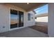 Covered patio with concrete flooring and sliding glass doors at 22045 N Rummler Ln, Maricopa, AZ 85138