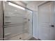 Modern glass-enclosed shower with built-in shelving and a sleek design at 22045 N Rummler Ln, Maricopa, AZ 85138