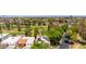Aerial view of home's roof featuring solar panels next to a beautiful golf course and surrounding neighborhood at 2322 S Rogers -- # 1, Mesa, AZ 85202