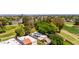 Aerial view of home with solar panels next to a beautiful golf course and surrounding neighborhood at 2322 S Rogers -- # 1, Mesa, AZ 85202