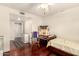 Bright bedroom with wood floors and ceiling fan offers a comfortable space at 2322 S Rogers -- # 1, Mesa, AZ 85202
