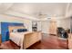 Large main bedroom featuring hardwood floors, ceiling fan, and access to an ensuite bath at 2322 S Rogers -- # 1, Mesa, AZ 85202