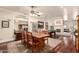 Dining area with a large wooden table, pool table, fireplace and view to backyard at 2322 S Rogers -- # 1, Mesa, AZ 85202