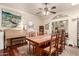Bright dining room with grand table, chairs, piano, and a beautiful view to other living spaces at 2322 S Rogers -- # 1, Mesa, AZ 85202
