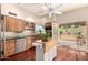 Charming kitchen featuring granite countertops, central island, and access to the outdoor patio at 2322 S Rogers -- # 1, Mesa, AZ 85202
