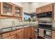 Bright kitchen with stainless steel appliances, granite countertops, and a view to the outside patio at 2322 S Rogers -- # 1, Mesa, AZ 85202