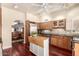 Bright kitchen with stainless steel appliances, wood cabinets, tile backsplash and backyard views at 2322 S Rogers -- # 1, Mesa, AZ 85202