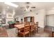 Open concept dining and living room with game table, fireplace and plenty of seating at 2322 S Rogers -- # 1, Mesa, AZ 85202