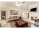 Bright living room with a cozy fireplace, comfortable seating, and a stylish area rug, creating a relaxing atmosphere at 2322 S Rogers -- # 1, Mesa, AZ 85202
