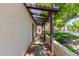 Covered walkway with a garden bed and manicured yard leads to home at 2322 S Rogers -- # 1, Mesa, AZ 85202