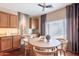 Cozy dining area next to the kitchen featuring natural light and neutral decor at 2323 W Kachina Trl, Phoenix, AZ 85041