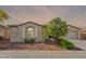Charming single-story home featuring a well-maintained front yard and a neutral color scheme at 2323 W Kachina Trl, Phoenix, AZ 85041