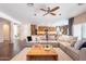 Bright living room with a comfortable sectional sofa and seamless access to the kitchen at 2323 W Kachina Trl, Phoenix, AZ 85041