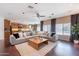 Open living space with a view of the kitchen and dining area, featuring stylish decor at 2323 W Kachina Trl, Phoenix, AZ 85041