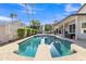 Backyard pool with diving board and lush greenery, creating a private outdoor oasis at 2333 E Egret Ct, Gilbert, AZ 85234