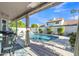 Backyard patio and pool surrounded by mature trees offering plenty of shade at 2333 E Egret Ct, Gilbert, AZ 85234