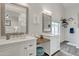 Bright bathroom features double sinks, framed mirrors and a makeup vanity at 2333 E Egret Ct, Gilbert, AZ 85234