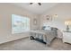 Neutral bedroom with carpet, window and ceiling fan at 2333 E Egret Ct, Gilbert, AZ 85234