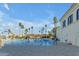 Resort-style community pool surrounded by lush landscaping and lounge chairs at 2333 E Egret Ct, Gilbert, AZ 85234