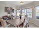 Inviting dining room with natural light and views of the outdoor pool area at 2333 E Egret Ct, Gilbert, AZ 85234