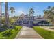 Impressive home with manicured lawn, towering palms, and a grand entrance at 2333 E Egret Ct, Gilbert, AZ 85234