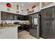 Kitchen featuring dark wood cabinetry, granite countertops, and stainless steel appliances at 2333 E Egret Ct, Gilbert, AZ 85234