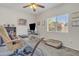 Bright home office space with carpet, window and ceiling fan at 2333 E Egret Ct, Gilbert, AZ 85234