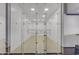Upper level view of racquetball court with glass doors and net at 2333 E Egret Ct, Gilbert, AZ 85234