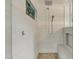 Modern shower features pebble floor, bench, and vertical tile accent at 2333 E Egret Ct, Gilbert, AZ 85234