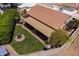 Aerial view of a home showcasing its terracotta roof, covered patio, lush backyard, and well-maintained landscaping at 2369 W Shawnee Dr, Chandler, AZ 85224